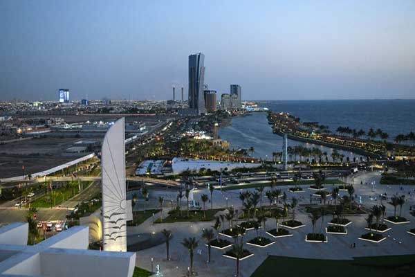 Nighttime cityscape of Jeddah with illuminated Corniche